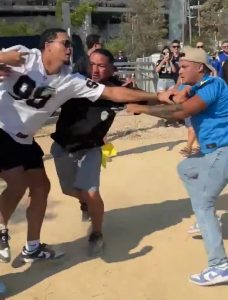 Sickening moment woman is body slammed and man is knocked out cold in huge NFL brawl before Chargers’ win over Raiders