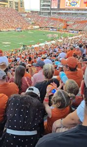 Watch shocking moment toddler appears to drink BEER at football game as fans say ‘that mom is definitely distracted’