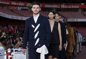 Alex Scott wows in Arsenal themed sleeveless outfit but Declan Rice steals show as he wears huge bow on fashion catwalk