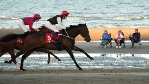 Inside the world’s most unique horse racing meet – where sunbathers and horses share a beach