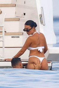 Cristiano Ronaldo squeezes Georgina Rodriguez’s bum as they relax in swimwear on yacht on holiday