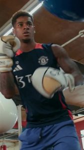 Watch as Marcus Rashford has medicine ball whacked off his abs as Man Utd star takes up boxing in international break