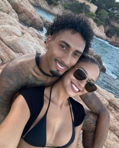 Former Premier League star shares beach pic with stunning bikini-clad wife before savaging troll in five words