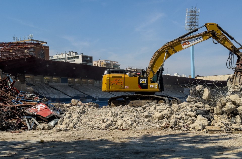 World Cup stadium lies half demolished next to rubble as it hosts second-tier matches with no away end