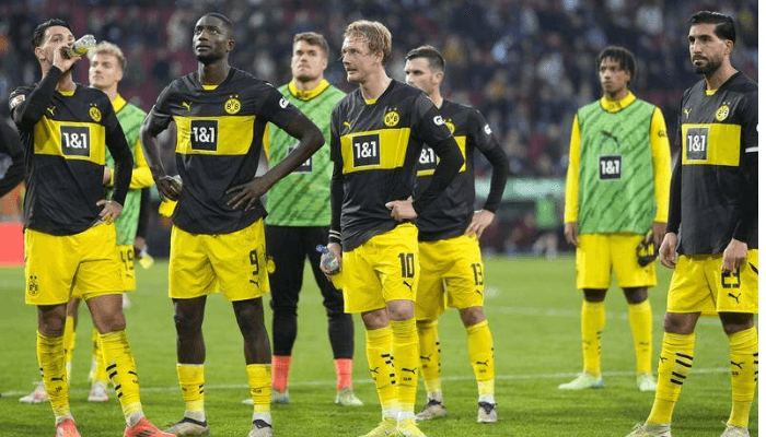 Dortmund’s title race suffers temporary set-back at Augsburg