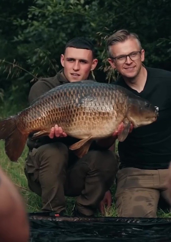 England ace Phil Foden yells ‘it’s a big one’ as he bags monster carp on fishing trip with TV expert