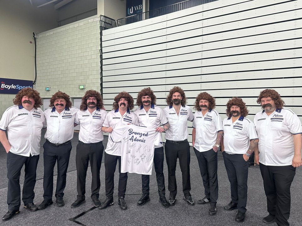 Darts stars all dress up as cult hero ‘Bronzed Adonis’ before his final Players Championship… how many can you name?