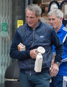 Liverpool legend Alan Hansen, 69, in good spirits at shop just four months after being hospitalised with serious illness