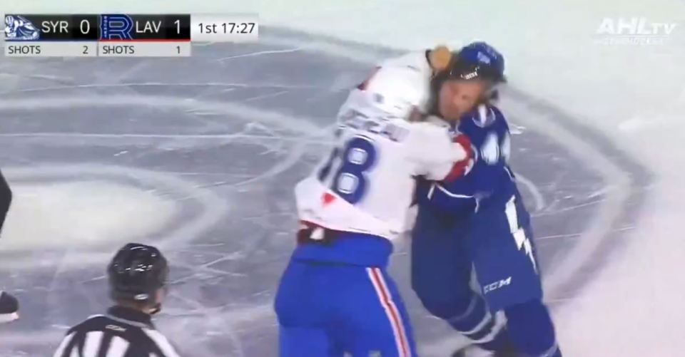 Gruesome moment ice hockey star snaps bent finger back into place after punching rival numerous times in head