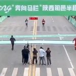 Watch hilarious moment fake marathon runner tries to cheat victory before being tackled by quick-thinking race official