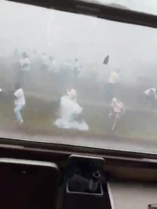 Terrifying moment football thugs launch firecrackers and stones at train filled with rival supporters