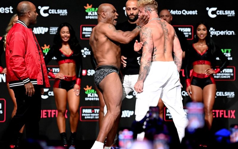 Mike Tyson SLAPS Jake Paul before being pulled apart by security in chaotic weigh in before controversial Netflix fight