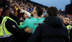 Wolves goalkeeper Jose Sa restrained by security after clashing with his OWN FANS with supporter booted out of stadium