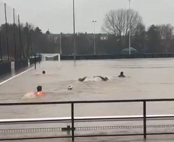 Non-league stars go SWIMMING on their pitch as entire stadium covered in water as Storm Bert wreaks havoc