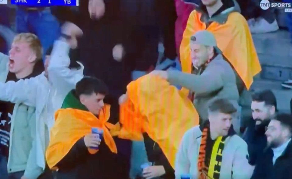 Shakhtar fan left gutted as mate knocks beer out of his hand during goal celebration