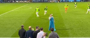 Bizarre moment man dressed as Elsa from Frozen sings Let It Go karaoke on pitch during FA Cup first-round clash