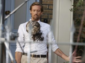 Peter Crouch gets white shirt covered in mud as he films TV ad for Ariel after signing six-figure deal