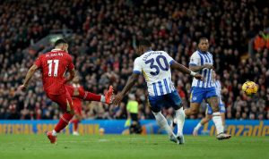 Liverpool 2 Brighton 1: Reds go top of Premier League after two goals in three second-half minutes seal comeback win