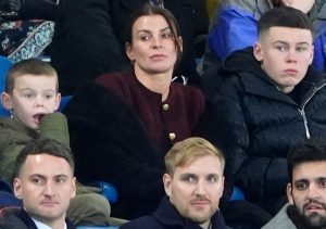 Coleen Rooney looks unimpressed as she watches on during Everton defeat with husband Wayne on brink of sack