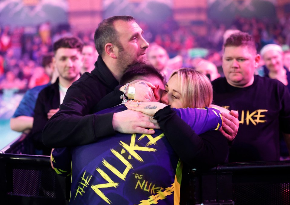 Emotional moment tearful Luke Littler, 17, breaks down in his parents’ arms after cutting interview short at darts