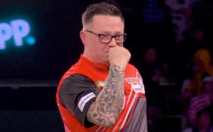 Darts journeyman and Iceland delivery driver fights back tears as he retains tour card with biggest win of his life