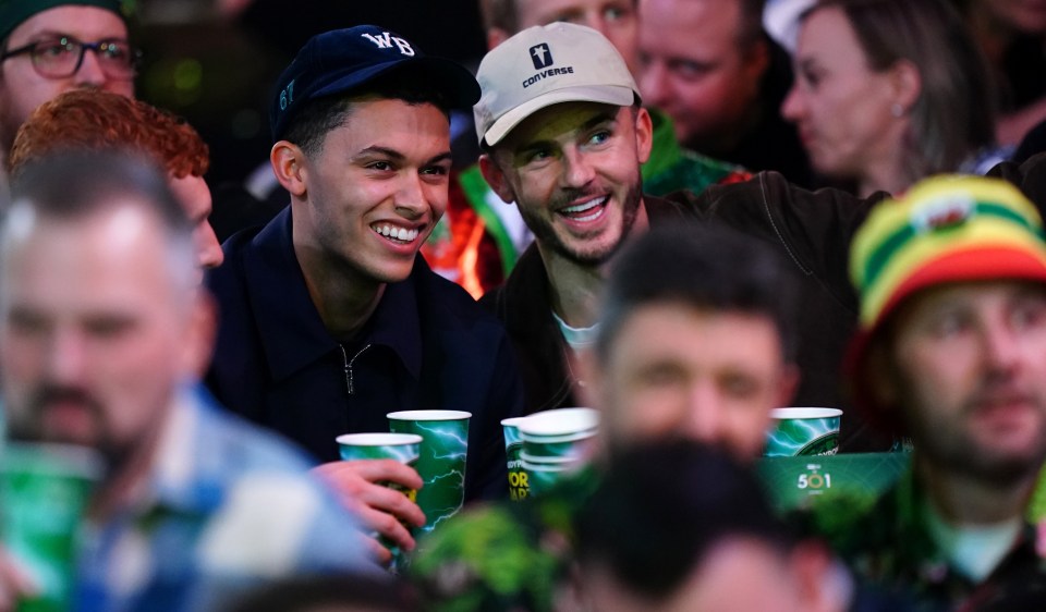 James Maddison and Brennan Johnson grin at World Darts Championship hours after Tottenham draw left Postecoglou ‘hurt’