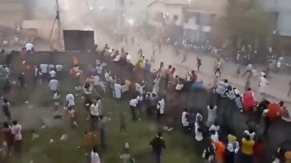 Fears up to 100 people dead in horror crush at football match in Guinea as shock footage shows fans trying to escape