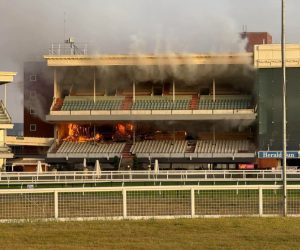 Man, 51, charged with arson after enormous fire rips through one of the world’s most famous racecourses